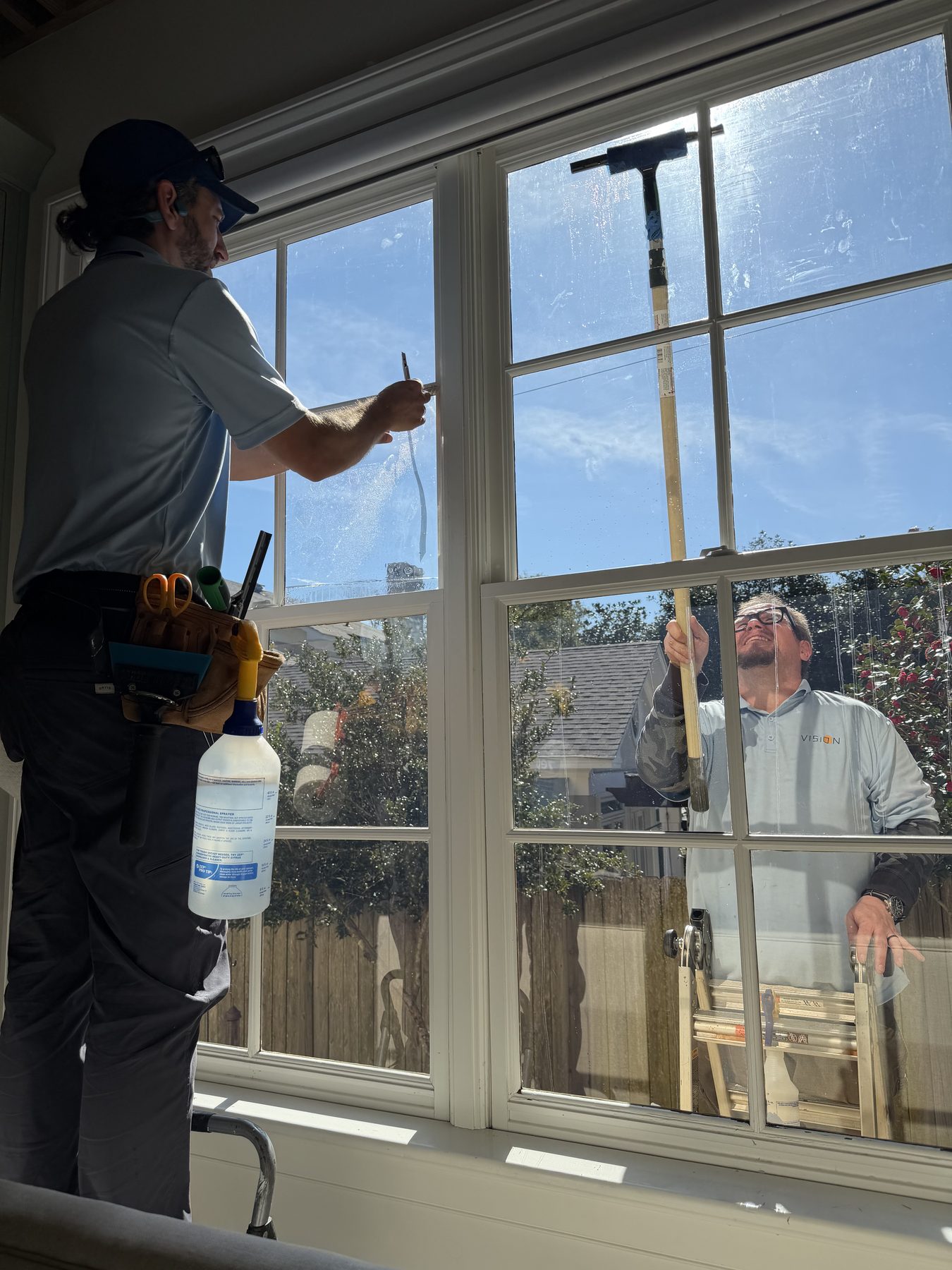 Clear spectrally selective film going onto a living room window in Mobile