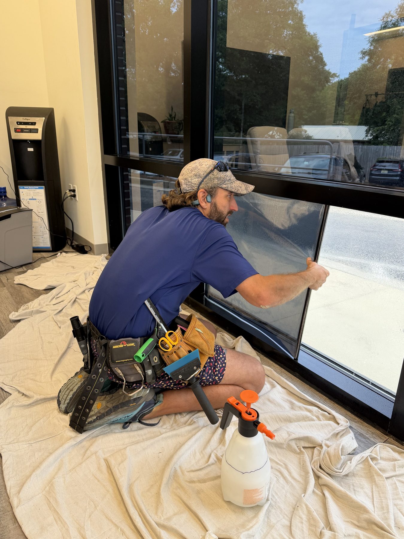 Cutting a large sheet of dual reflective film against a straightedge