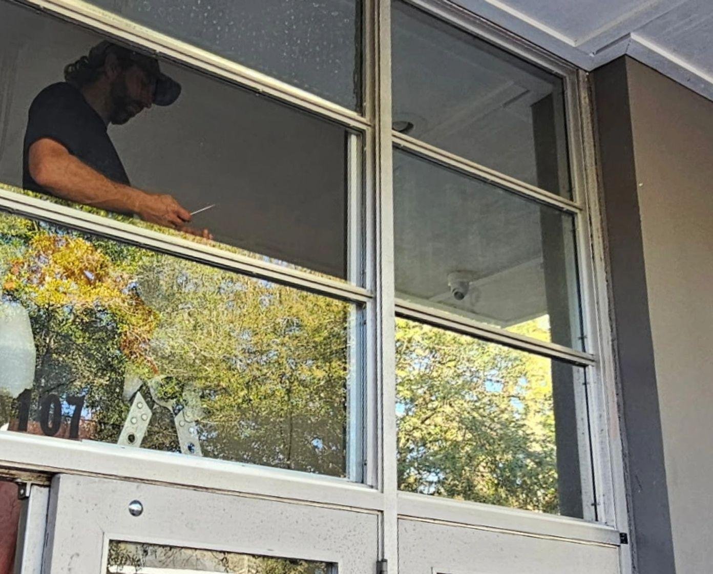 Privacy film going onto transom glass in Midtown Mobile
