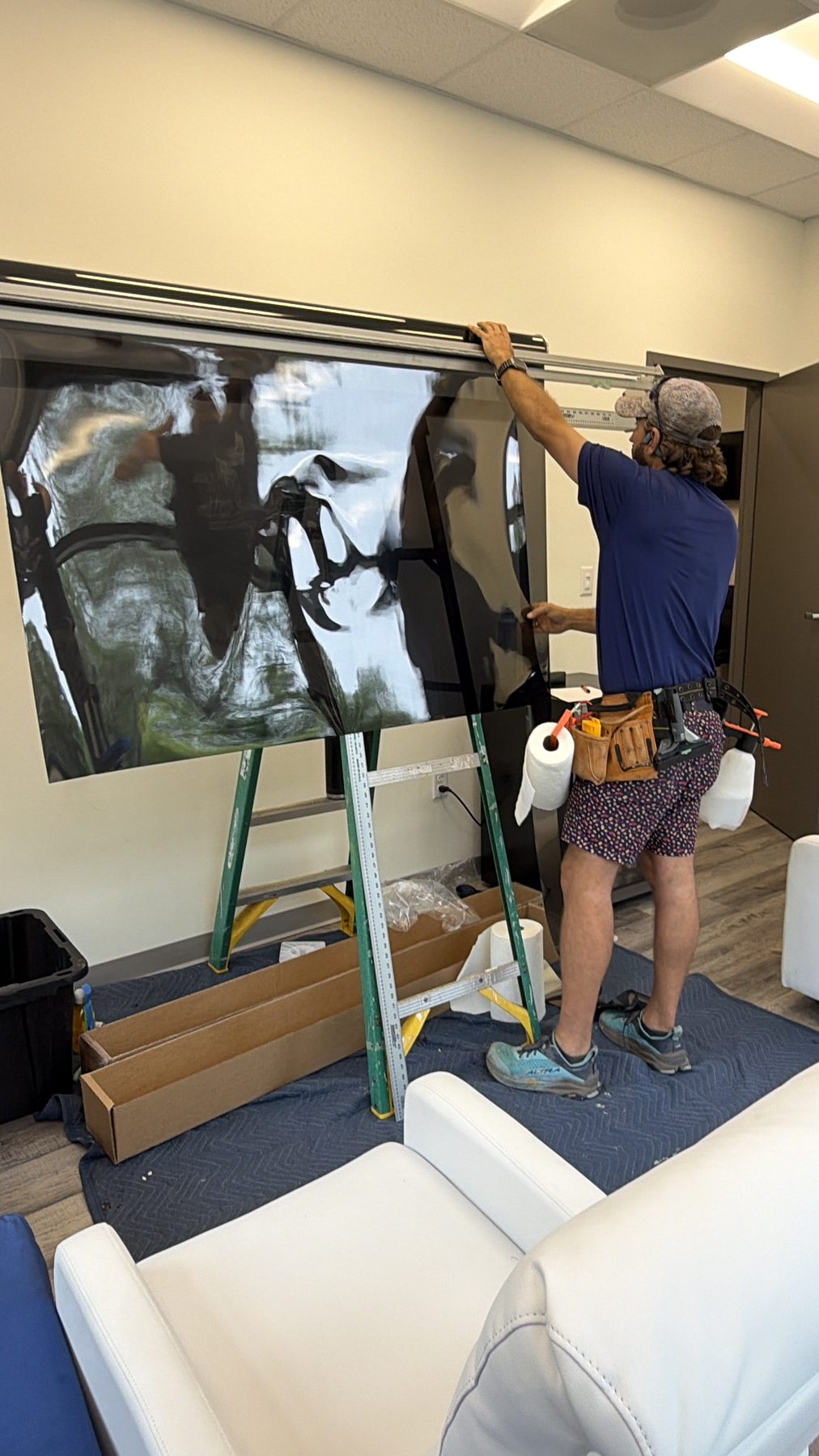 Film going onto the glass at a Fairhope medical office