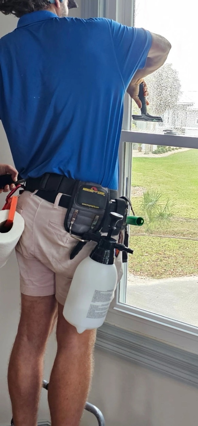Squeegeeing water out from behind freshly installed film